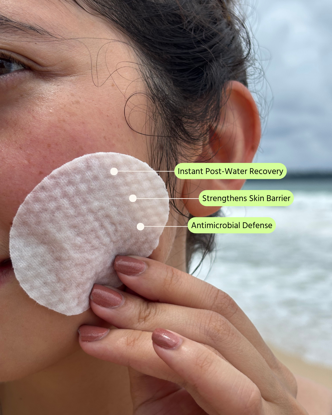 A person applying an M.O.Y. Breakthrough The Splash ampoule pad after water activities to deeply hydrate, support post-water skin recovery, strengthen the skin barrier, and provide antimicrobial defense.
